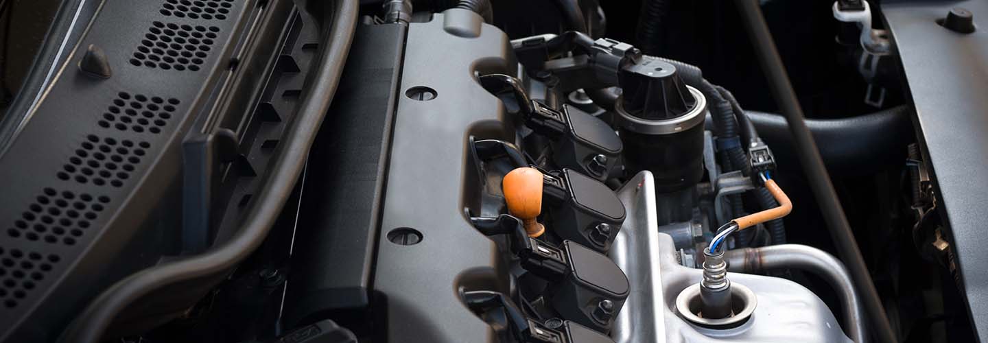 Close up of brand new four cylinder car engine